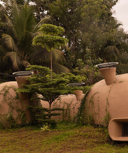 fluid ferrocement shell sculpts cavernous spaces for earthscape studio's home in india