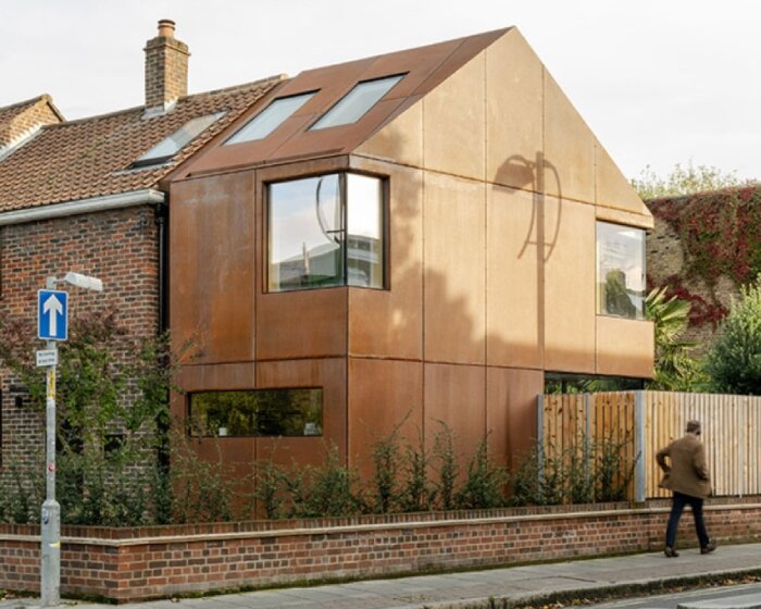 rusty corten steel extension modernizes 1950s brick home in london