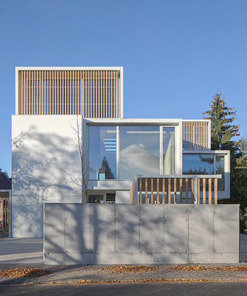 pavilion-like forms and large openings of 'weave house' shield urban views in warsaw